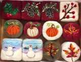 A collection picture of some of the wool needle felted soaps by artist and soapmaker, Marjie Sanderson. 